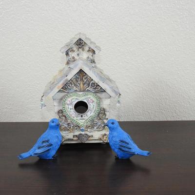 Fancy birdhouse and blue birds