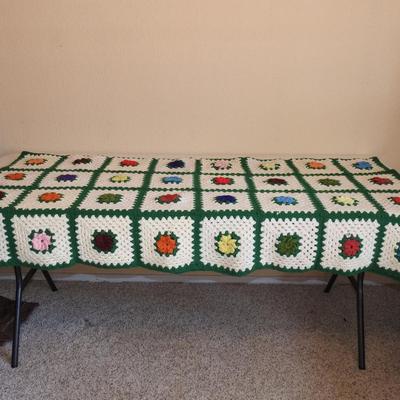 Crocheted granny square afghan
