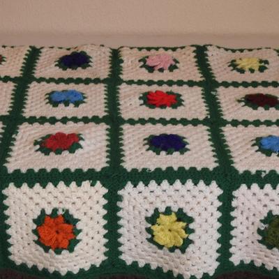 Crocheted granny square afghan