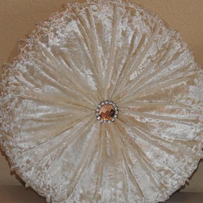 Crushed velvet round tufted pillows