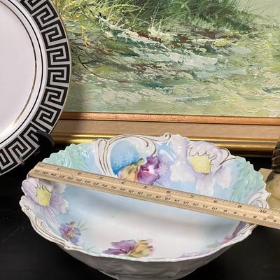 Vintage Plates and Marble Hold Books