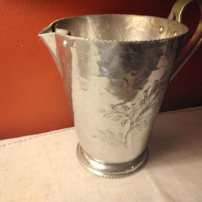 Hammered Aluminum pitcher with flower design