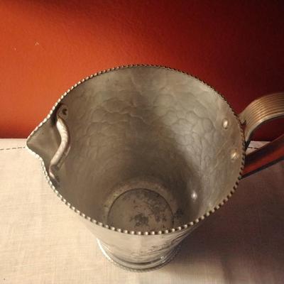 Hammered Aluminum pitcher with flower design