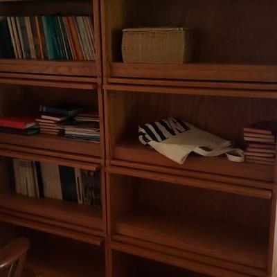 2 vintage large  bookcases with fold up glass doors.