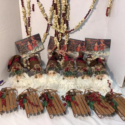 Lot 1563 Lot of Wonderful Santa Heads / Wooden Sleighs with Cranberries / Faux Cranberry& Popcorn Garland ( Four NEW IN PKG )