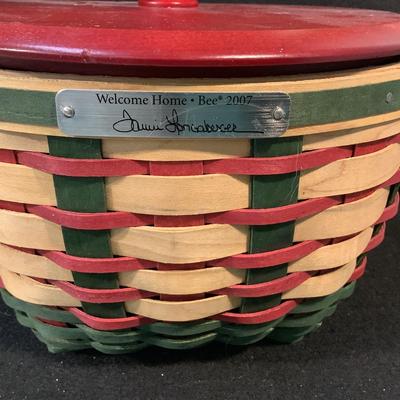 Lot 1575. Three Longaberger Welcome Home Bee 2007 Baskets with Leather Handles/Wooden Lids