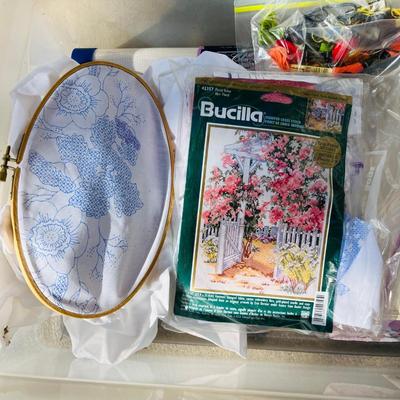 Tub of embroidery kits and partial done projects