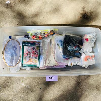 Tub of embroidery kits and partial done projects