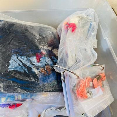 Tub of embroidery kits and partial done projects