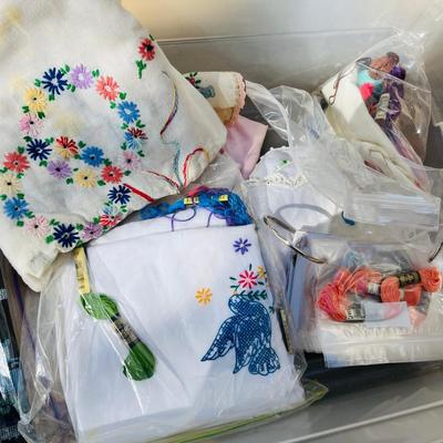 Tub of embroidery kits and partial done projects