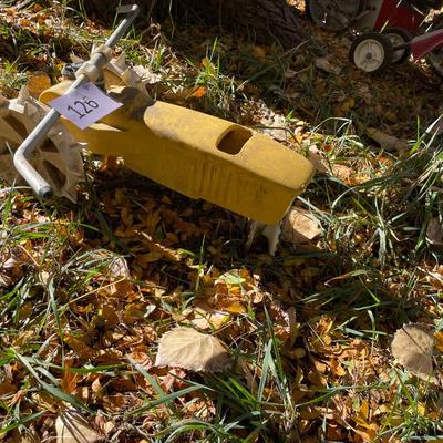 Yellow tractor lawn sprinkler