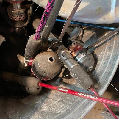 Trash Can full of Fishing Poles