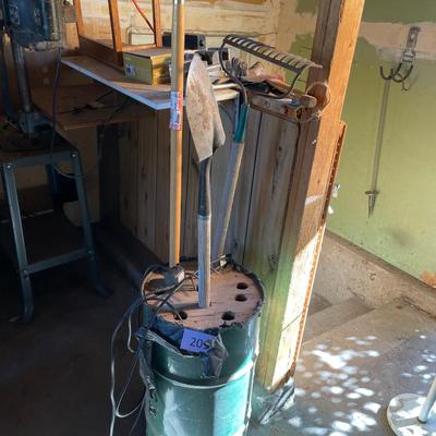 Bucket with yard tools