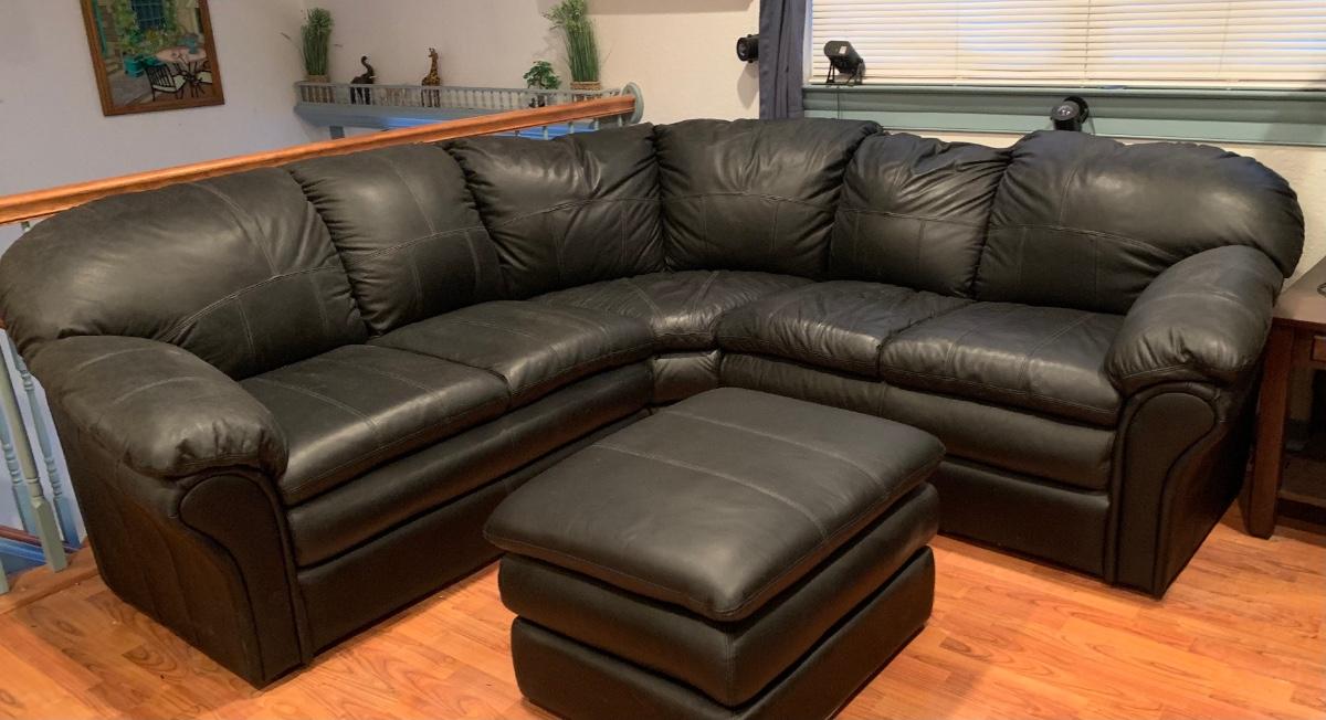 LOT 100 Black Faux Leather Sectional Sofa