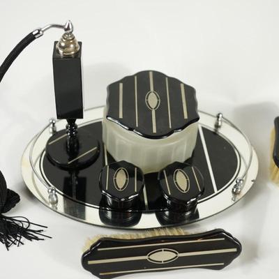 NINE PIECE ART DECO VANITY SET TO BLACK W/SILVER TRIM.