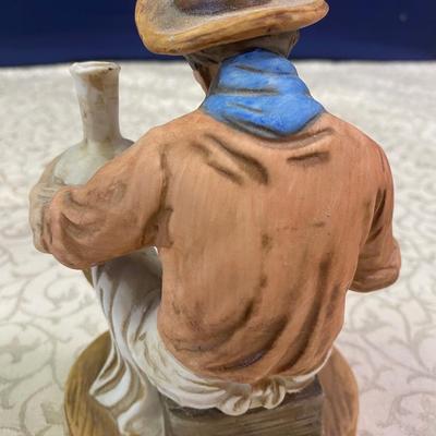 Vintage Potter Painting a Pot