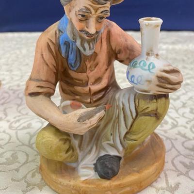 Vintage Potter Painting a Pot