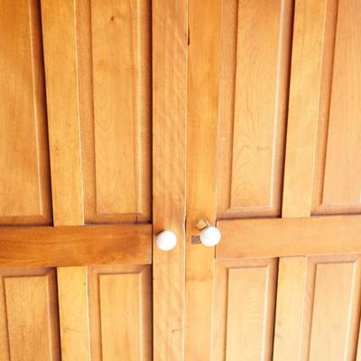 VINTAGE LIGHT COLORED CHERRY PANELLED CABINET W/LOWER DRAWER /TWO SHELVES