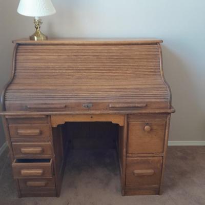 ANTIQUE MACEY ROLL TOP DESK WITH WOODEN CHAIR AND BRASS LAMP
