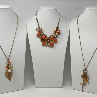 The Gold Tone with Pink and Peach Accent Necklace Lot