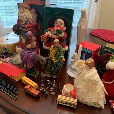 Whole lot a Christmas, Jesus, Mary, Joseph, Santas with boxes, train