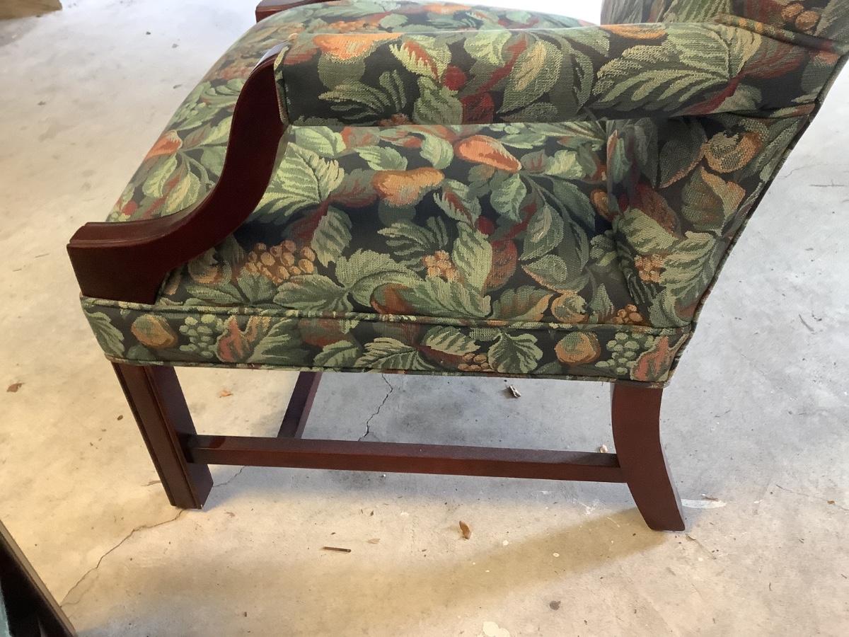 2 upholstered arm chairs with wooden legs and arms with slip covers