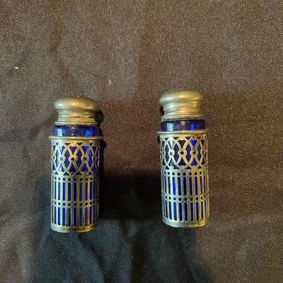 pair of (4) vintage glass bottles and pair of salt and pepper shakers