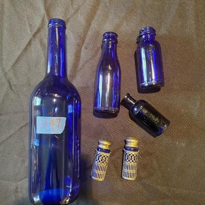 pair of (4) vintage glass bottles and pair of salt and pepper shakers