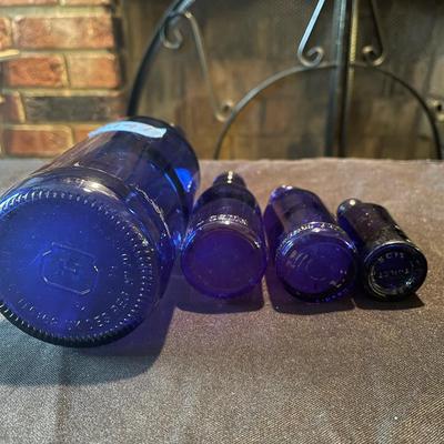 pair of (4) vintage glass bottles and pair of salt and pepper shakers