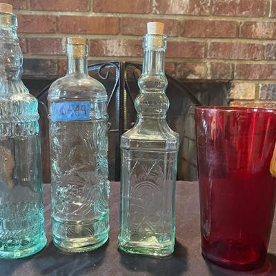 (3) vintage glass bottles, (1) red vase