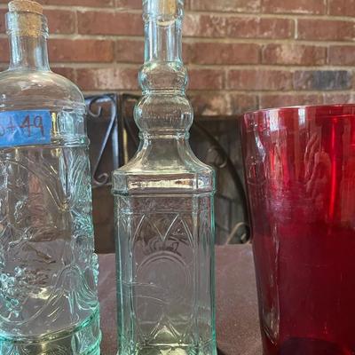 (3) vintage glass bottles, (1) red vase