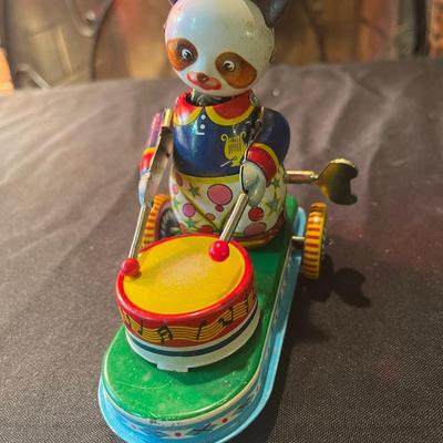Antique tin panda and drum toy