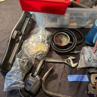 Plastic container, plastic tool carrier, antique misc. knobs, oil can, wrenches, pliers, locks, laserlevel pro, hole puncher, bag of...