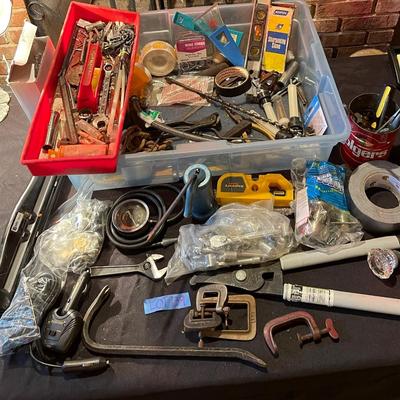 Plastic container, plastic tool carrier, antique misc. knobs, oil can, wrenches, pliers, locks, laserlevel pro, hole puncher, bag of...