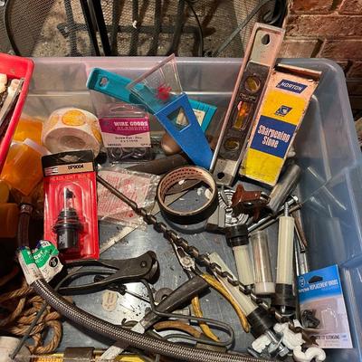 Plastic container, plastic tool carrier, antique misc. knobs, oil can, wrenches, pliers, locks, laserlevel pro, hole puncher, bag of...