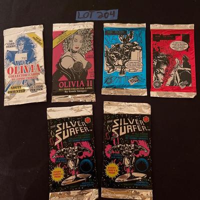 (2) Olivia comic cards, (20 Tribe-The Intro, (2) The silver surfer.