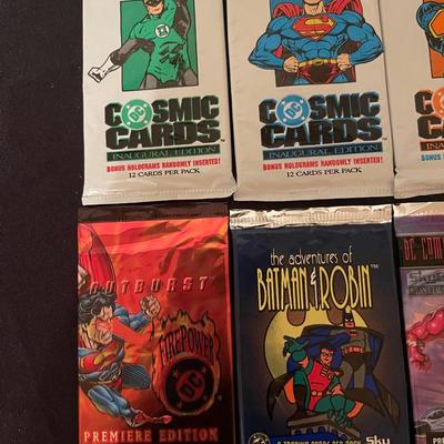 (4) DC cosmic cards inaugural edition, (4) Skybox DC comic cards.