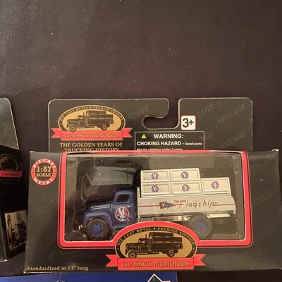 (2) diecast golden years of trucking history trucks, (1) Hot Wheels Kyle Petty