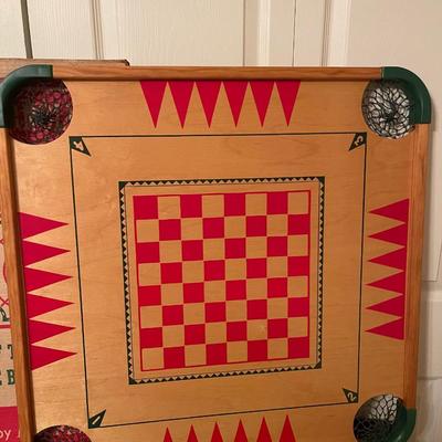 Antique Carom and Crokinole "100 play board" by Merdel includes sticks, intrustuctions, box, board and extra parts.