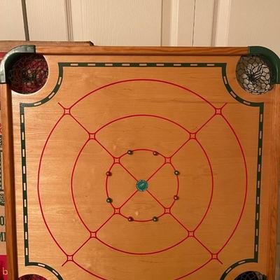 Antique Carom and Crokinole "100 play board" by Merdel includes sticks, intrustuctions, box, board and extra parts.