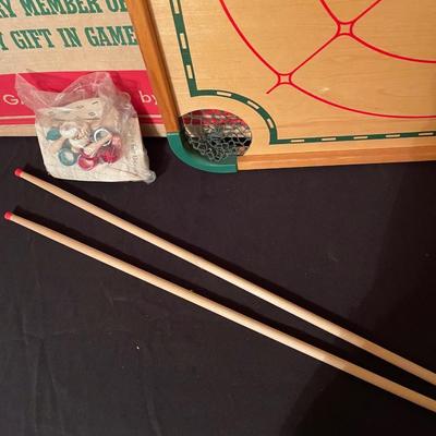 Antique Carom and Crokinole "100 play board" by Merdel includes sticks, intrustuctions, box, board and extra parts.