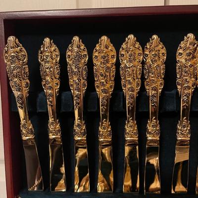 F.B. Rogers plated gold flatware set with case.