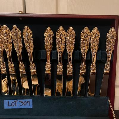 F.B. Rogers plated gold flatware set with case.