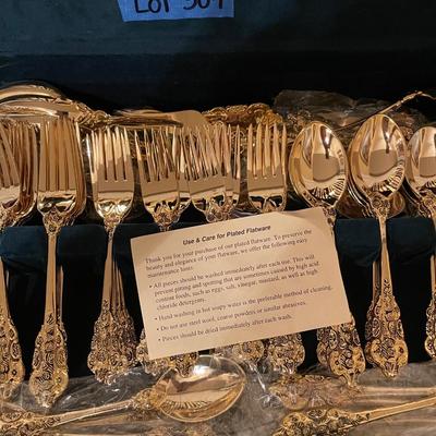 F.B. Rogers plated gold flatware set with case.