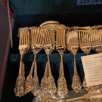 F.B. Rogers plated gold flatware set with case.