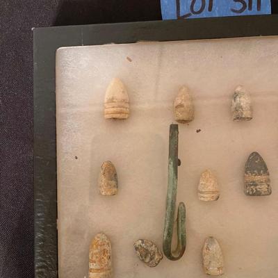Case of vintage bullets and relics