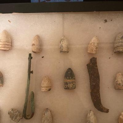 Case of vintage bullets and relics