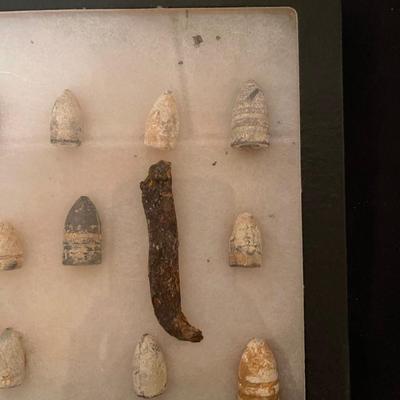 Case of vintage bullets and relics