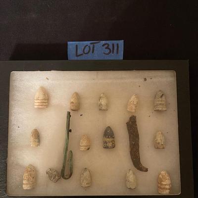 Case of vintage bullets and relics
