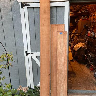 Huge wood board lot & (2) 24ft ladders 